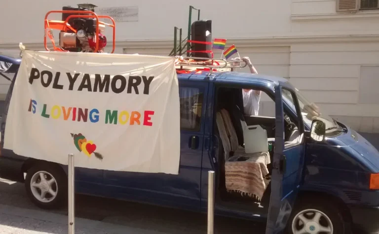 How to start polyamory: a van decorated for a Polyamory Pride parade, its white banner reading POLYAMORY IS LOVING MORE beneath rainbow flags
